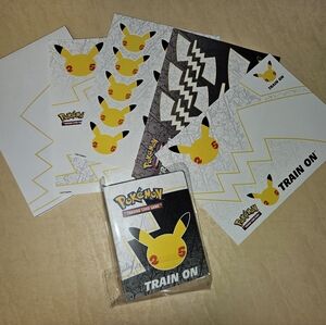Pokemon Celebrations Collector Chest stickers, notepad, and mini portfolio